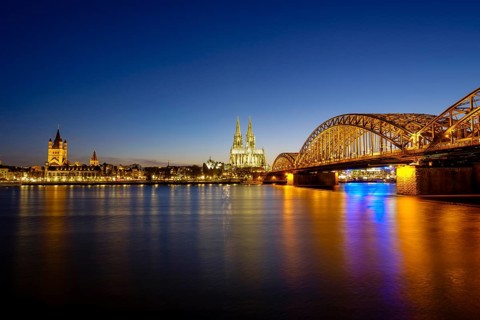 Church St Martins and Cologne Cathedral with Hohenzollern Bridge over the Rhine