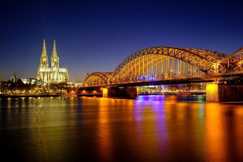 Cologne Cathedral with Hohenzollern Bridge over the Rhine