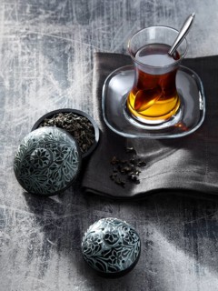 Tea in glass on gray napkin