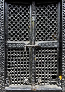 Artfully carved window grilles in traditional Newar style in Kumari Chowk inner courtyard