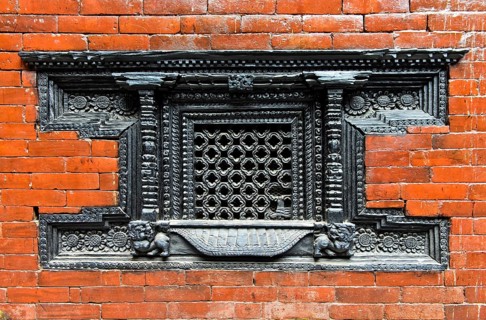 Artfully carved window grilles in traditional Newar style in Kumari Chowk inner courtyard