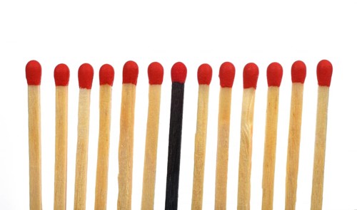 A black match among several bright matches