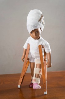 Doll with bandaged head