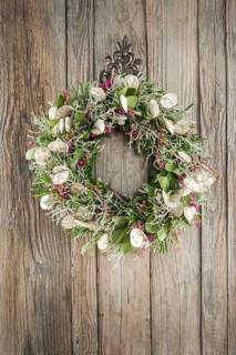 Autumn wreath on wooden wall