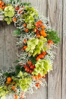 Autumn wreath on wooden wall cutout