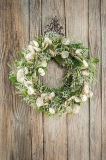 Autumn wreath on wooden wall