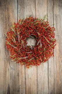 Autumn wreath on wooden wall