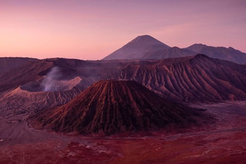 Volcanic pipes with smoking volcano Gunung Bromo