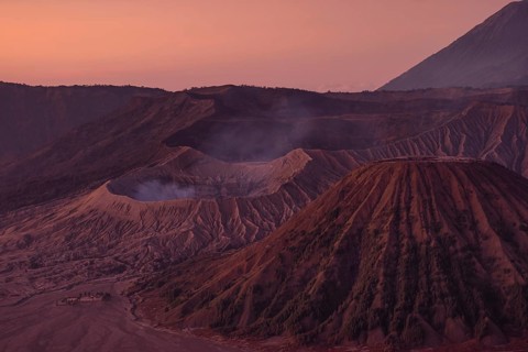 Volcanic pipes with smoking volcano Gunung Bromo