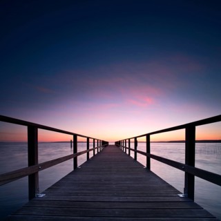 Long jetty at the lake at sunrise