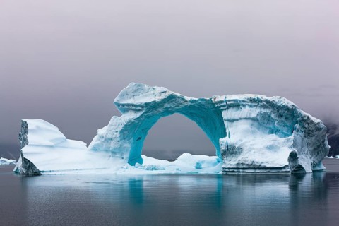 Ice bow in Scoresbysund at dawn