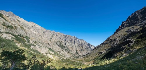 Restonica river flows at its source through mountain valley