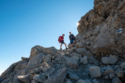 Two hikers ascending to the Hochvogel
