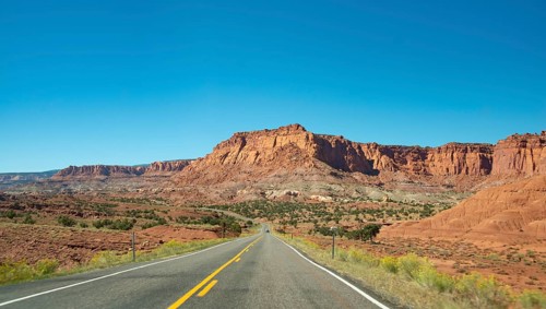 Red rugged sandstone cliffs on Highway 24