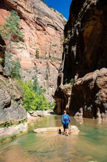 Hiker walks in the water