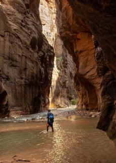 Hiker walks in the water