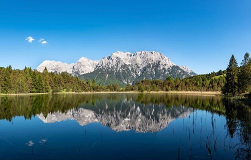 Western Karwendelspitze is reflected in Lake Luttensee