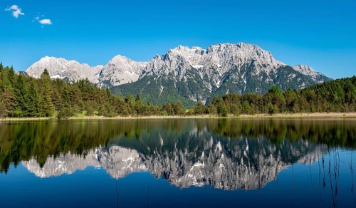 Western Karwendelspitze is reflected in Lake Luttensee