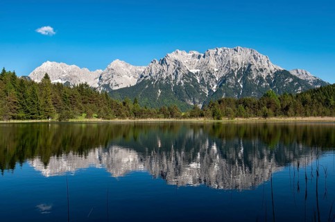 Western Karwendelspitze is reflected in Lake Luttensee