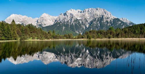 Western Karwendelspitze is reflected in Lake Luttensee