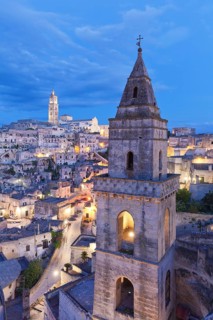 View of Church of San Pietro Barisano and Sasso Barisano historic centre with cathedral at dusk