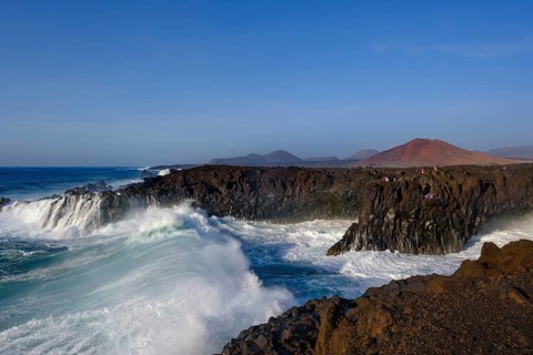 Surf at rocky coast