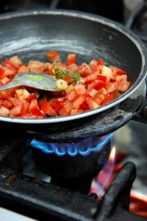 Diced tomatoes stewing in a pan