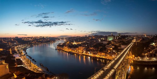 View over Porto with illuminated Ponte Dom Luis I Bridge across River Douro