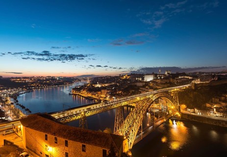 View over Porto with illuminated Ponte Dom Luis I Bridge across River Douro