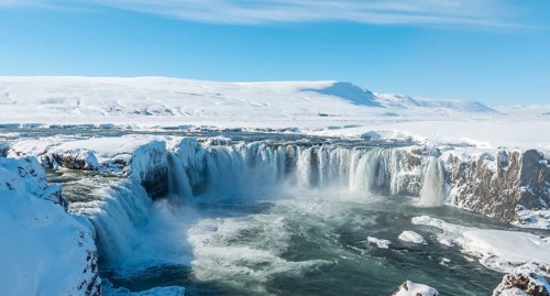 Gooafoss Waterfall in winter with snow and ice