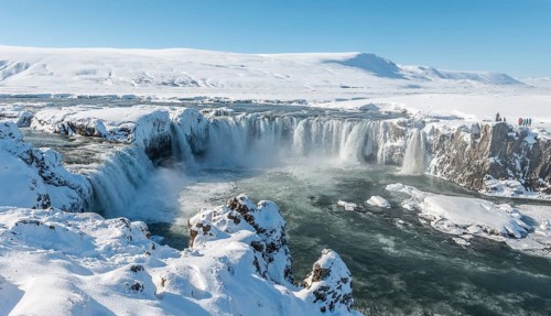 Gooafoss Waterfall in winter with snow and ice