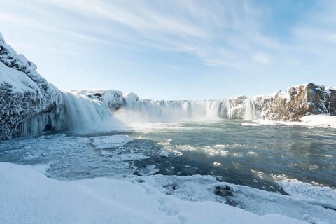 Gooafoss Waterfall in winter with snow and ice