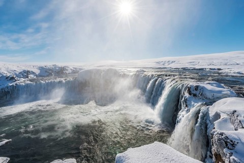 Gooafoss Waterfall in winter with snow and ice
