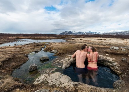 Young couple kissing in hot spring