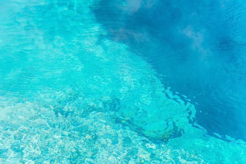 Turquoise clear water of a hot spring