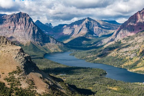 View from Continental Divide Trail onto Mountain Lake Two Medicine Lake with mountain landscape
