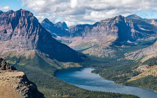 View from Continental Divide Trail onto Mountain Lake Two Medicine Lake with mountain landscape