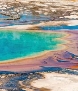 Colored mineral deposits at the edge sr steaming hot spring