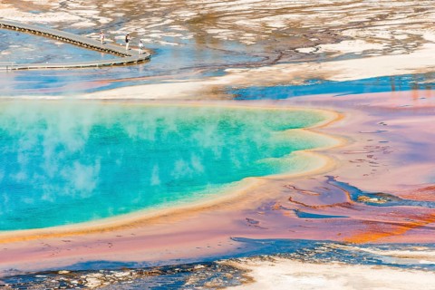 Colored mineral deposits at the edge sr steaming hot spring