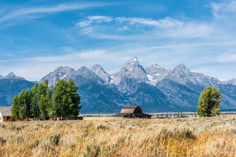 Historic old barn in front of the Teton Range mountain range