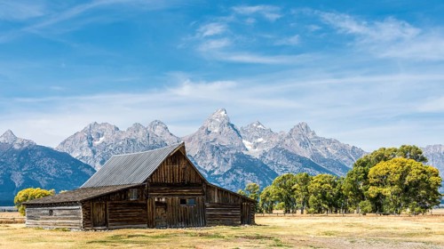Historic old barn in front of the Teton Range mountain range