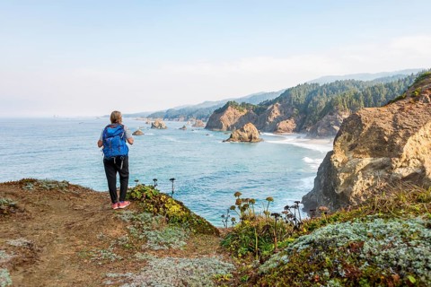 Young woman looking out to sea