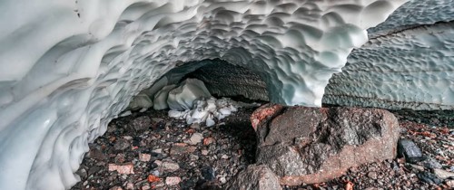 Entrance of an ice cave of a glacier