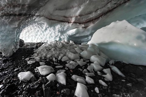 Entrance of an ice cave of a glacier