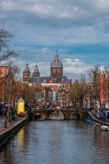 View from a bridge at Oudezijds Voorburgwal to the canal and the Sint Nicolaaskerk