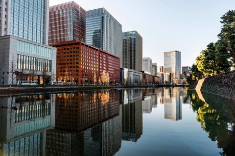 High-rise buildings reflected in a canal