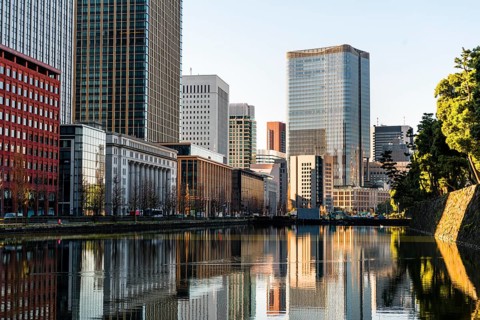 High-rise buildings reflected in a canal