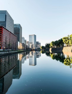 High-rise buildings reflected in a canal