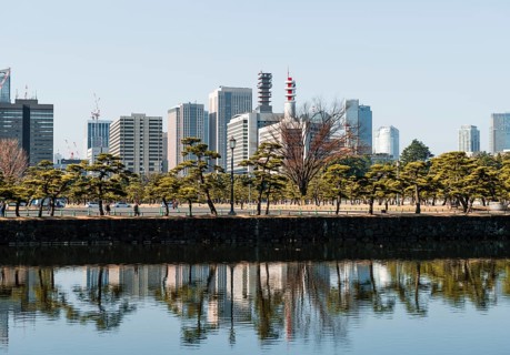 High-rise buildings reflected in a canal