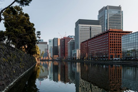 High-rise buildings reflected in a canal